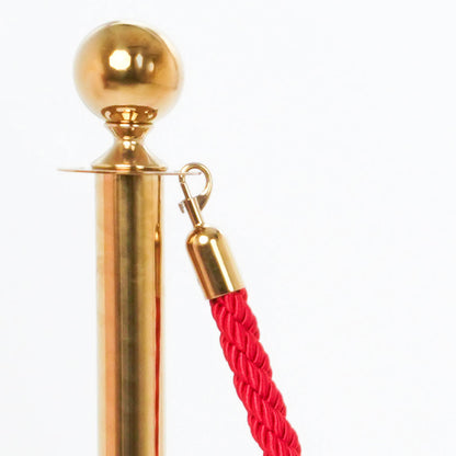 poste dorado con cordón rojo